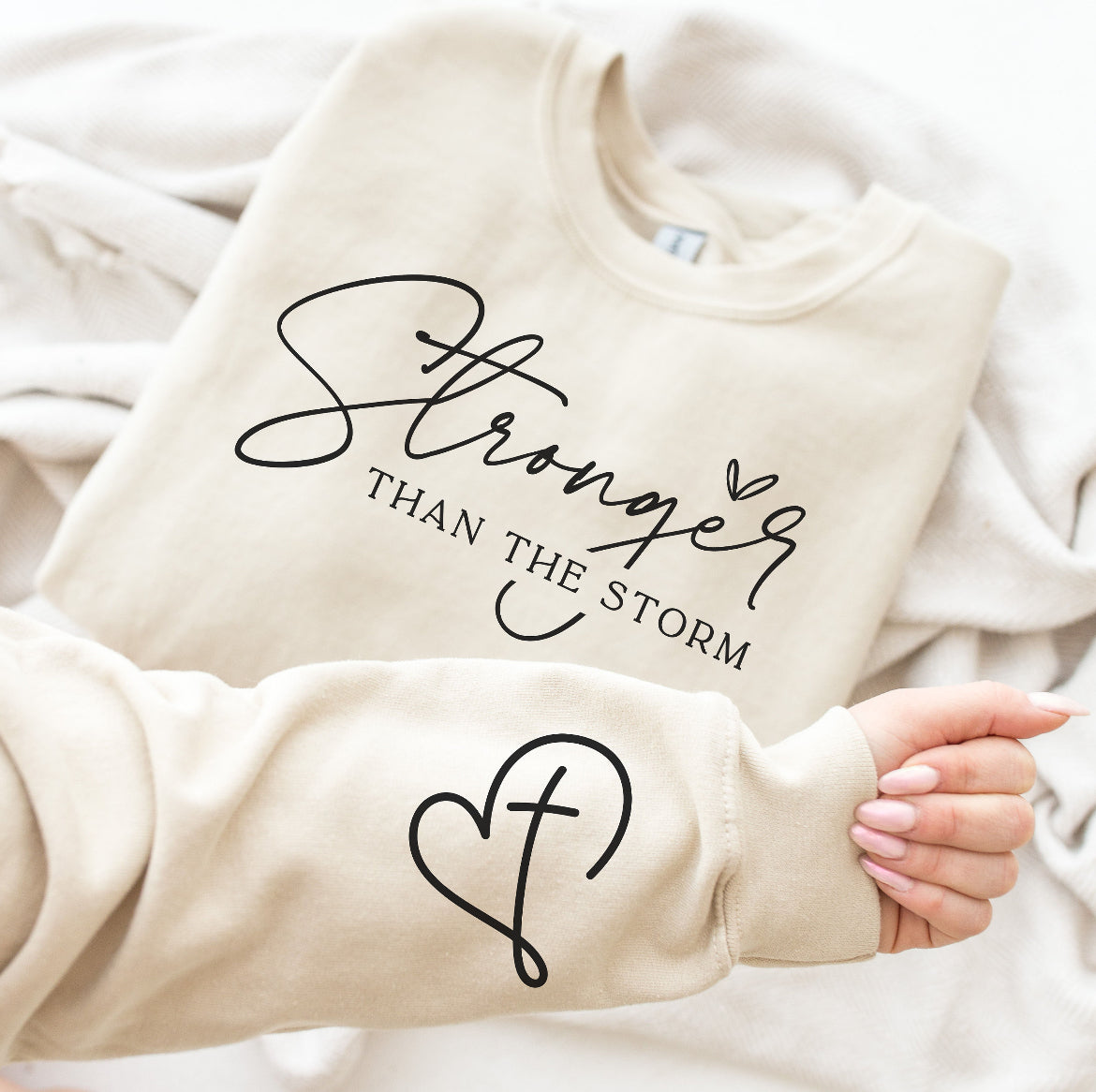 STRONGER THAN THE STORM SWEATSHIRT